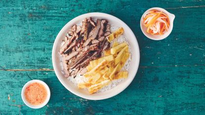 Cambodian pork and rice with omelette and pickled vegetables