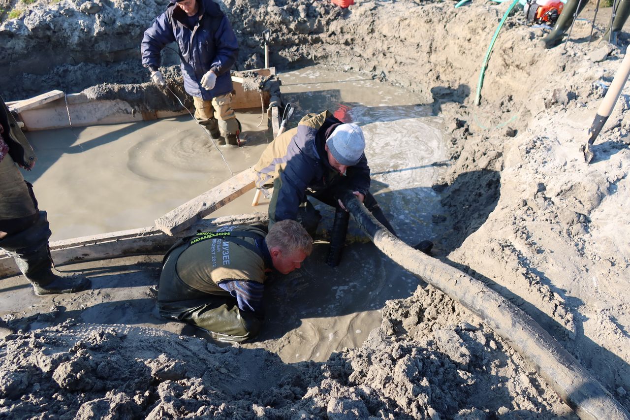 The sump pump allowed the excavation team to clear out the water.