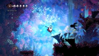 Screenshot from Hollow Knight: Silksong. Protagonist Hornet is falling towards the floor.