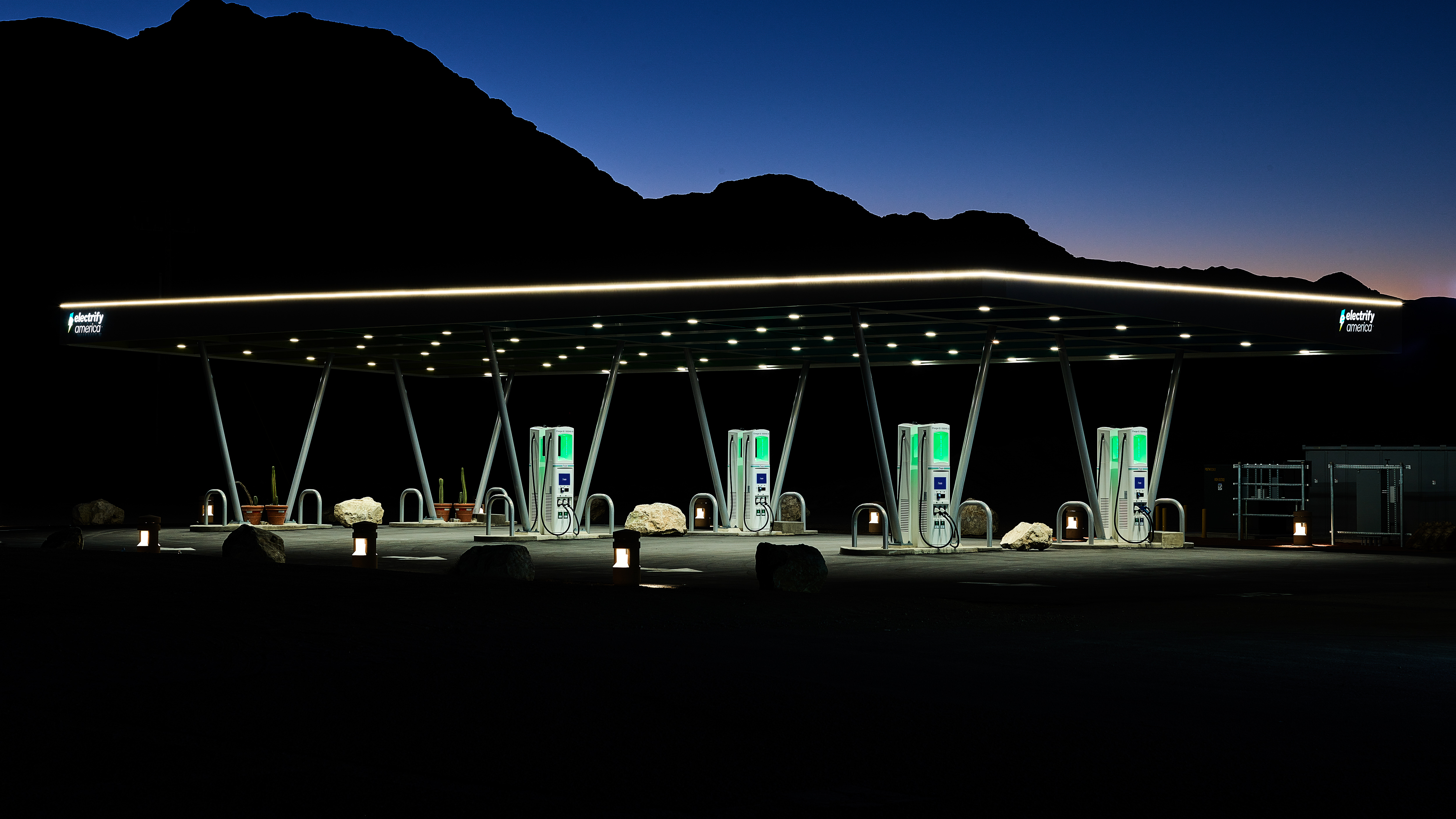 An Electrify America charging station at night