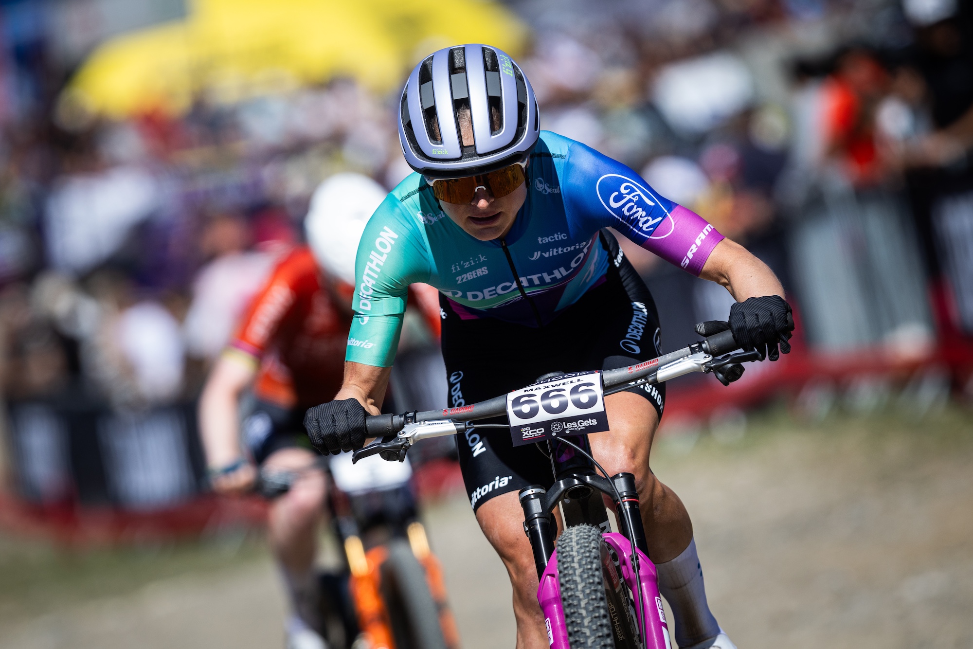 Sammie Maxwell (Decathlon Ford) charges through the field at the UCI MTB World Series Les Gets round