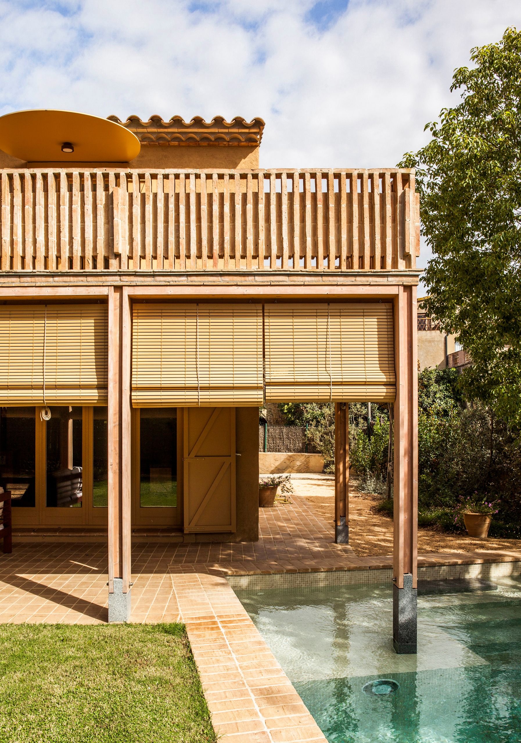 The pool intersects with the new veranda