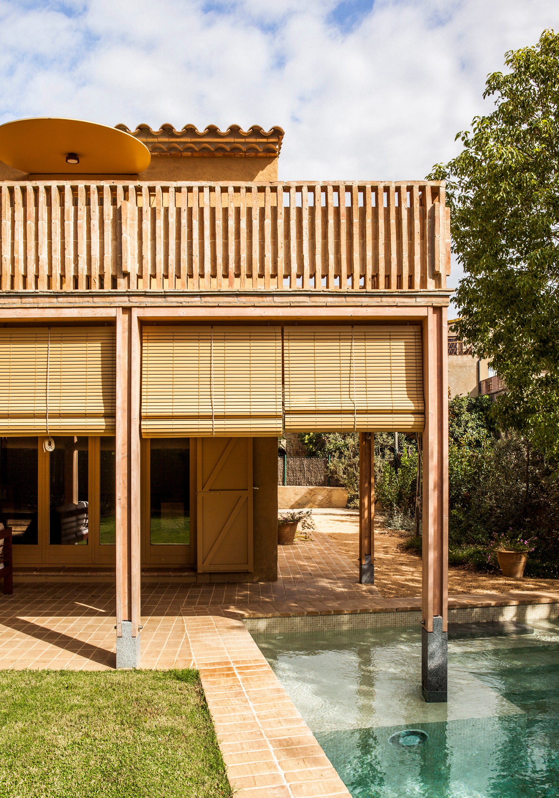 The pool intersects with the new veranda