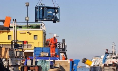 A salvage team prepares to begin recovering thousands of tons of fuel from the capsized Costa Concordia.