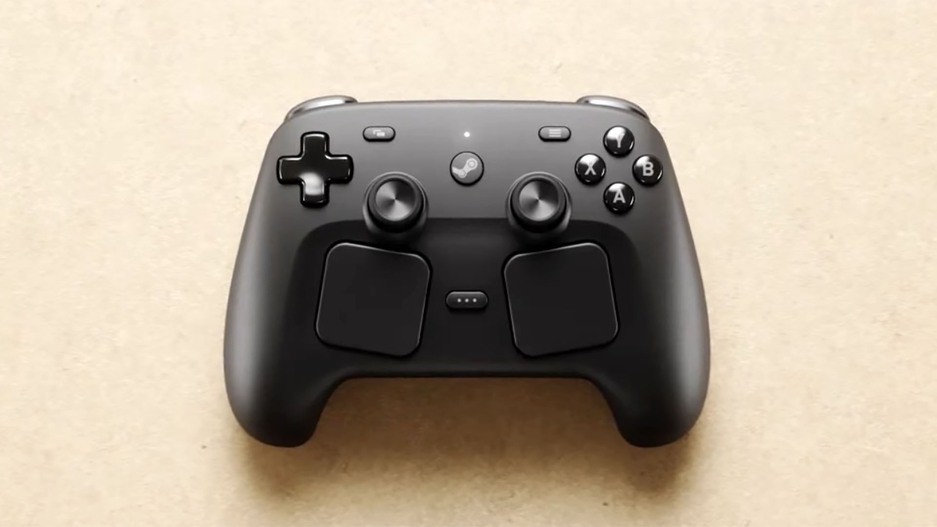 Valve's Steam Controller on a yellow background. 