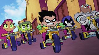 The Teen Titans riding tricycles in Teen Titans Go! to the Movies
