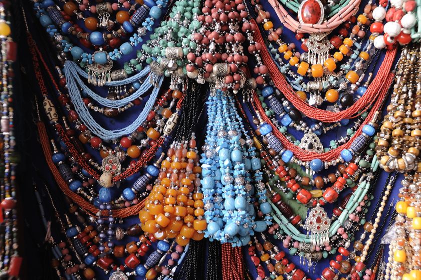 Beads, necklaces and jewellery at a market in Marrakesh provide colour and texture for a close up shot