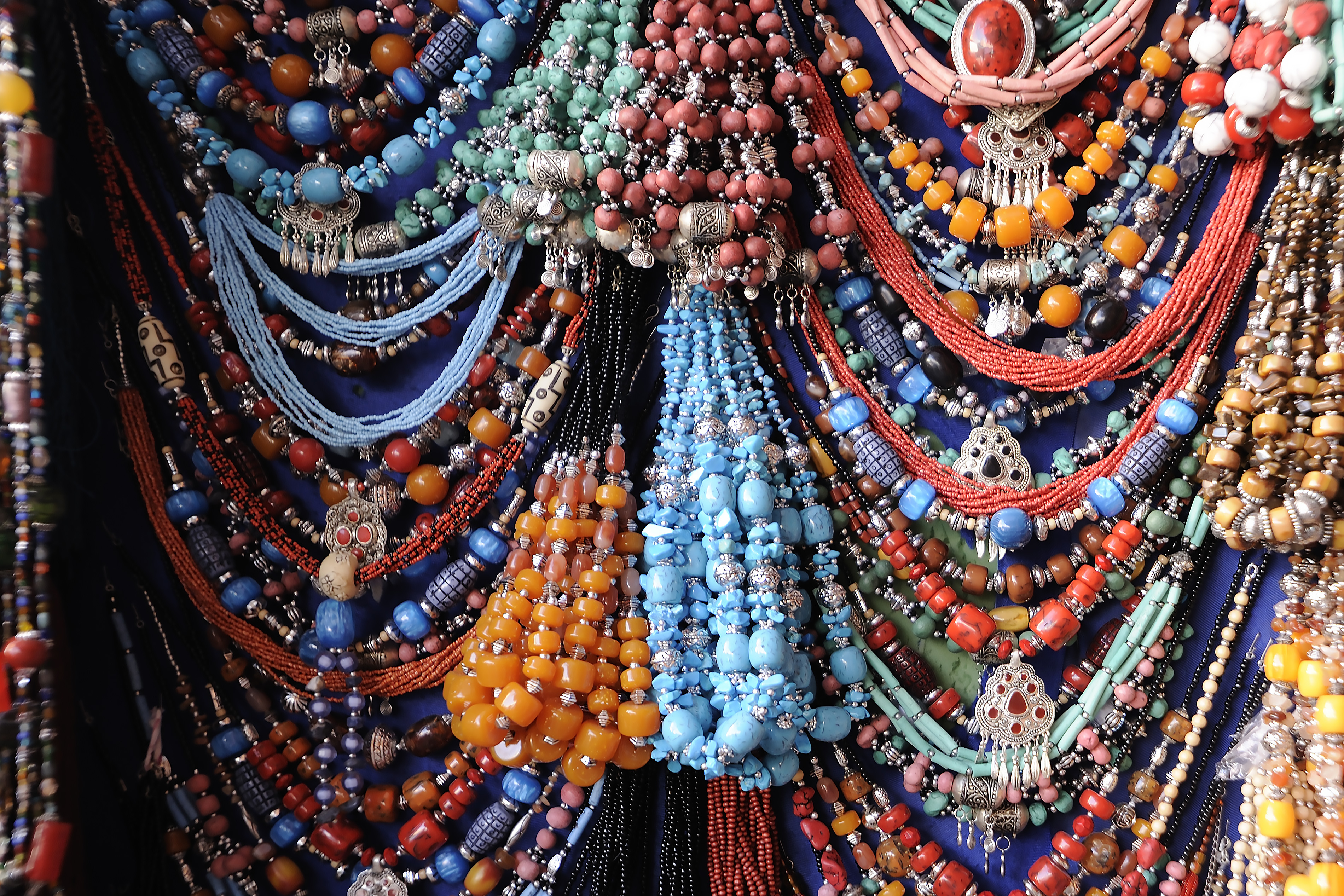Beads, necklaces and jewellery at a market in Marrakesh provide colour and texture for a close up shot