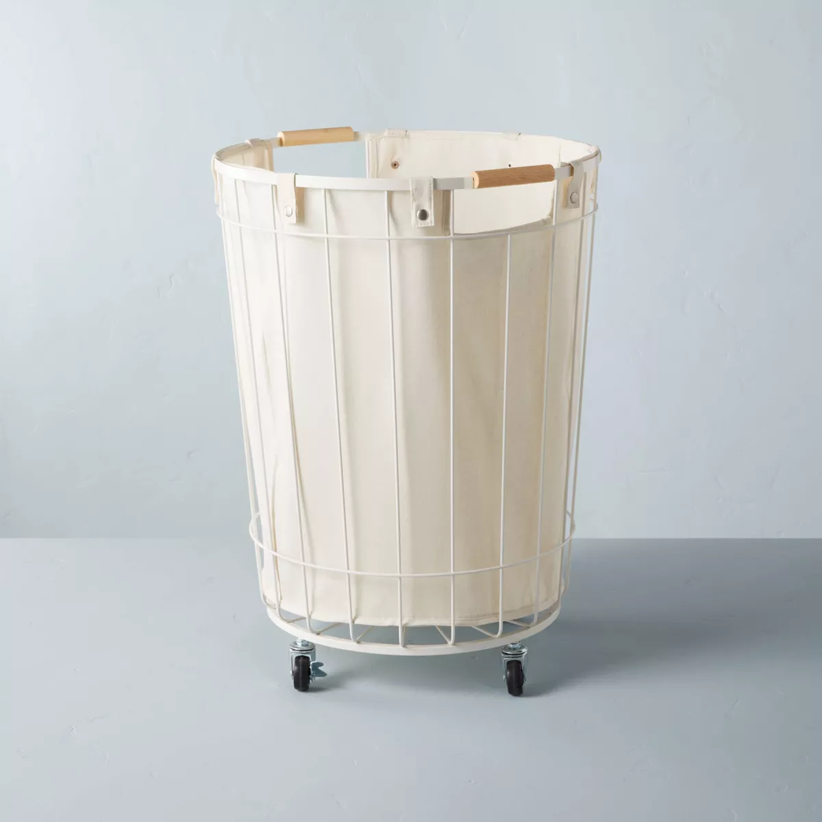 Laundry basket in cream with white wire design