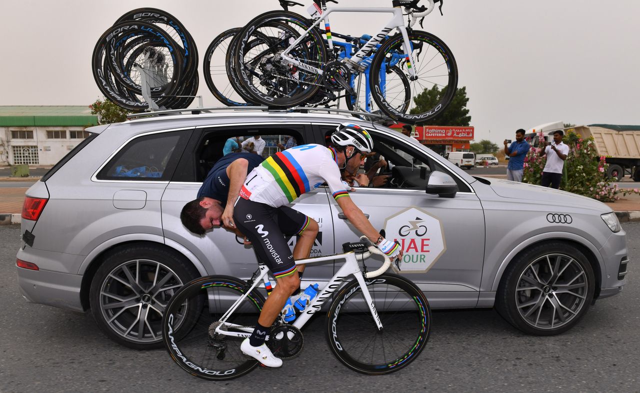 Alejandro Valverde gets some mechanical work after being caught up in the early crash