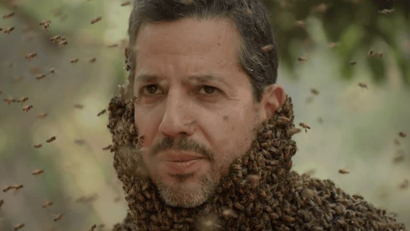 Magician David Blaine covered in bees in a scene from his new TV series, David Blaine: Do Not Attempt 2025