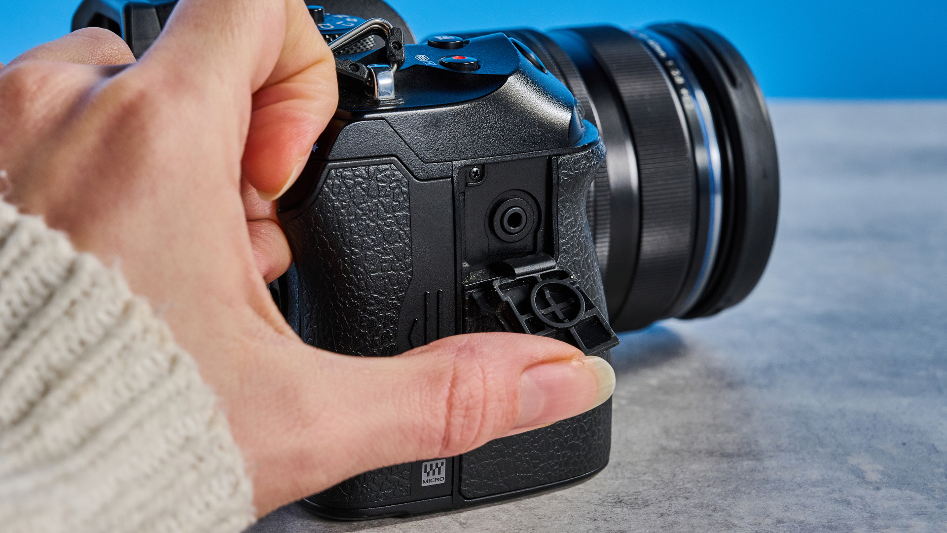 A black OM System OM-1 Mark II Micro Four Thirds mirrorless camera