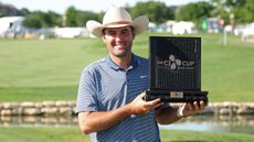 Scottie Scheffler poses for a photo with the CJ Cup Byron Nelson trophy 