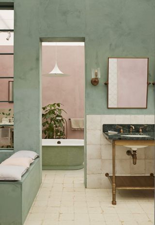 Light green and pink bathroom suite with dark green marble sink