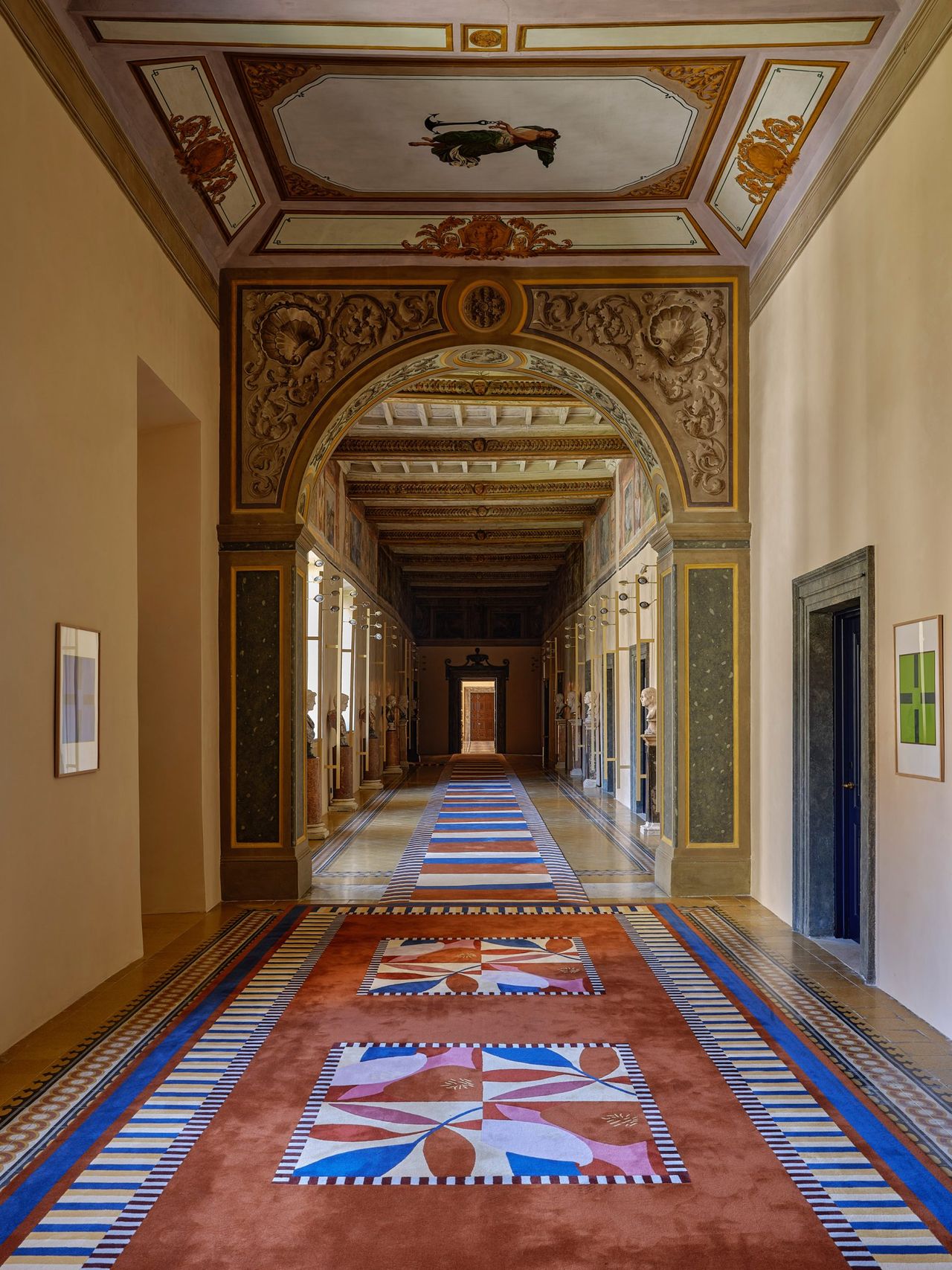 A spectacular hotel sited in a historical palazzo features colorful rugs and frescos-filled walls.