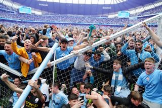 Manchester City fans invade the pitch at full-time