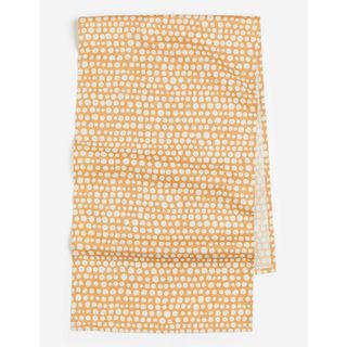 a yellow spotted tablecloth