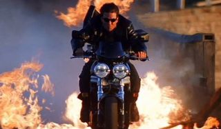 Mission: Impossible 2 Tom Cruise rides a motorcycle through fire
