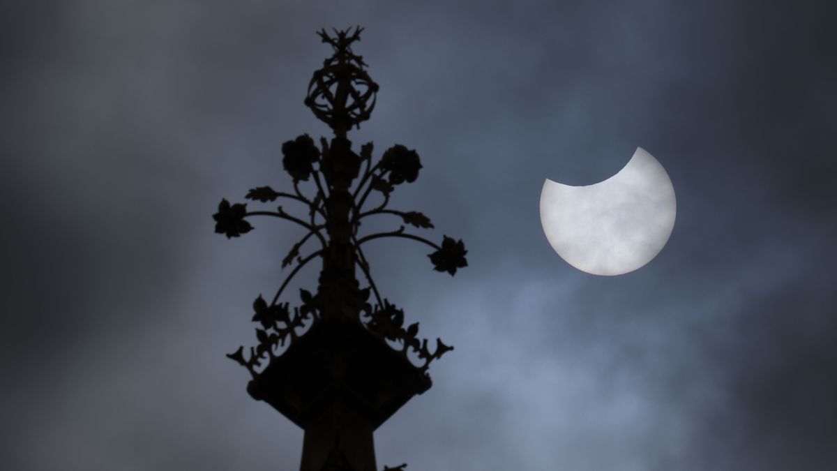 The eclipsed sun seen next to London's Big Ben on June 10, 2021, as photographed by Dan Kitwood.