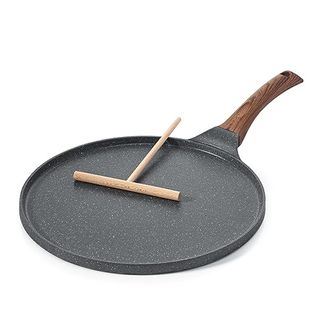 Crepe pan with wooden paddle for spreading batter