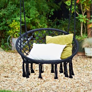 black swing chair with cushions