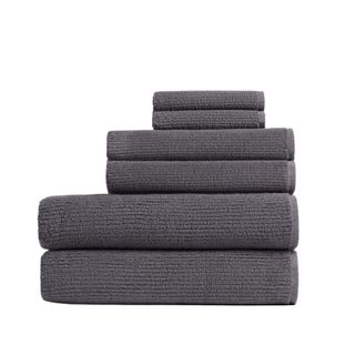 A stack of gray ribbed bath towels