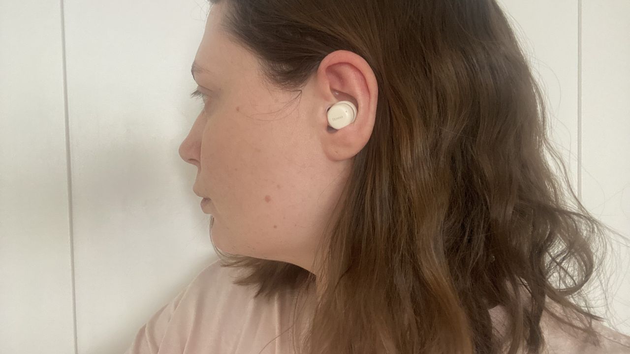 A close up of the Fitnexa SomniPods 3 ear bud in our tester's ear