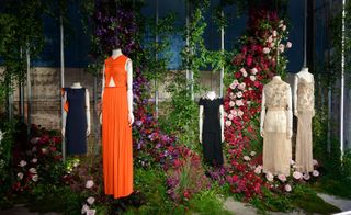 Mannequins in dresses in black, coral and creme