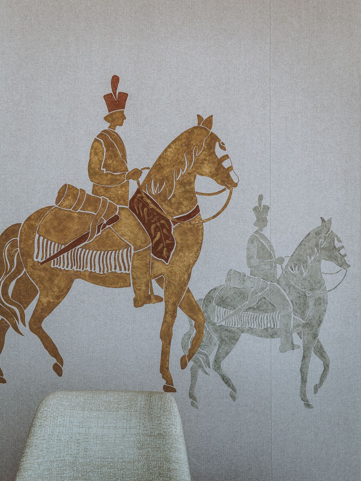 A minimalist hotel with cream tones throughout boasts floor-to-ceiling windows, historical accents, and a naturally lit atmosphere.