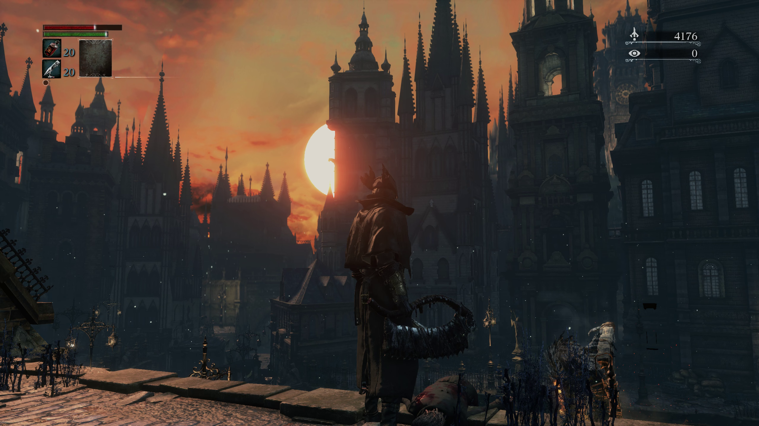 Hunter looking out over Yharnam cityscape in Bloodborne.