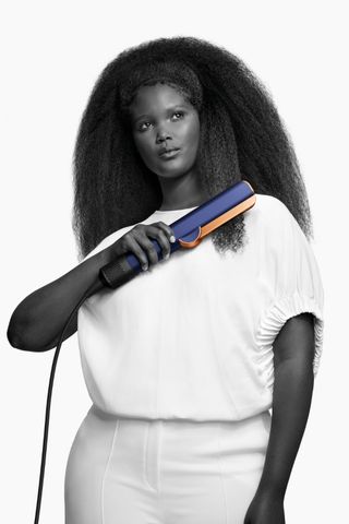 Model with Afro hair using Dyson Airstrait