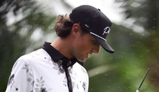 Grant Horvat looks at the ground