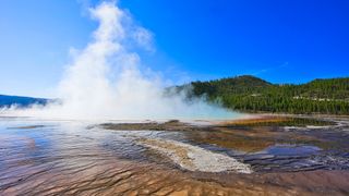 Old Failthful geyser eruption at Yellowstone National Park