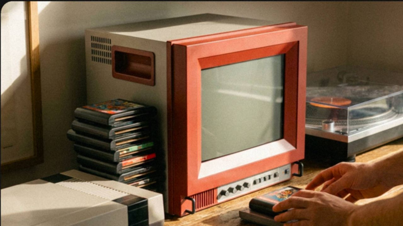 TRAVELLER ULW10 on woodgrain bench with Sega Genesis cartridges and NES on left and a turntable on right.