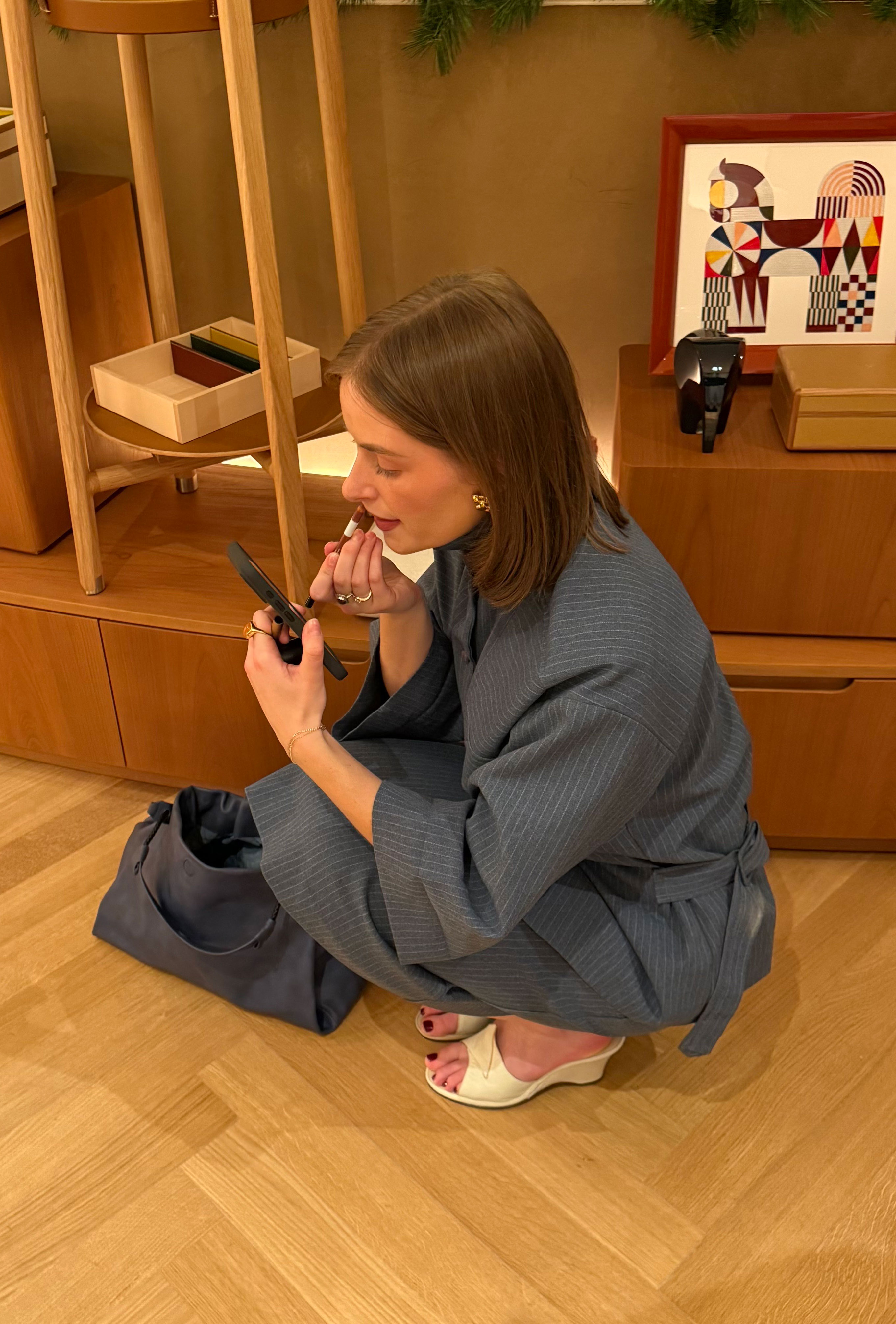 Bridget Brown wears a gray top and skirt