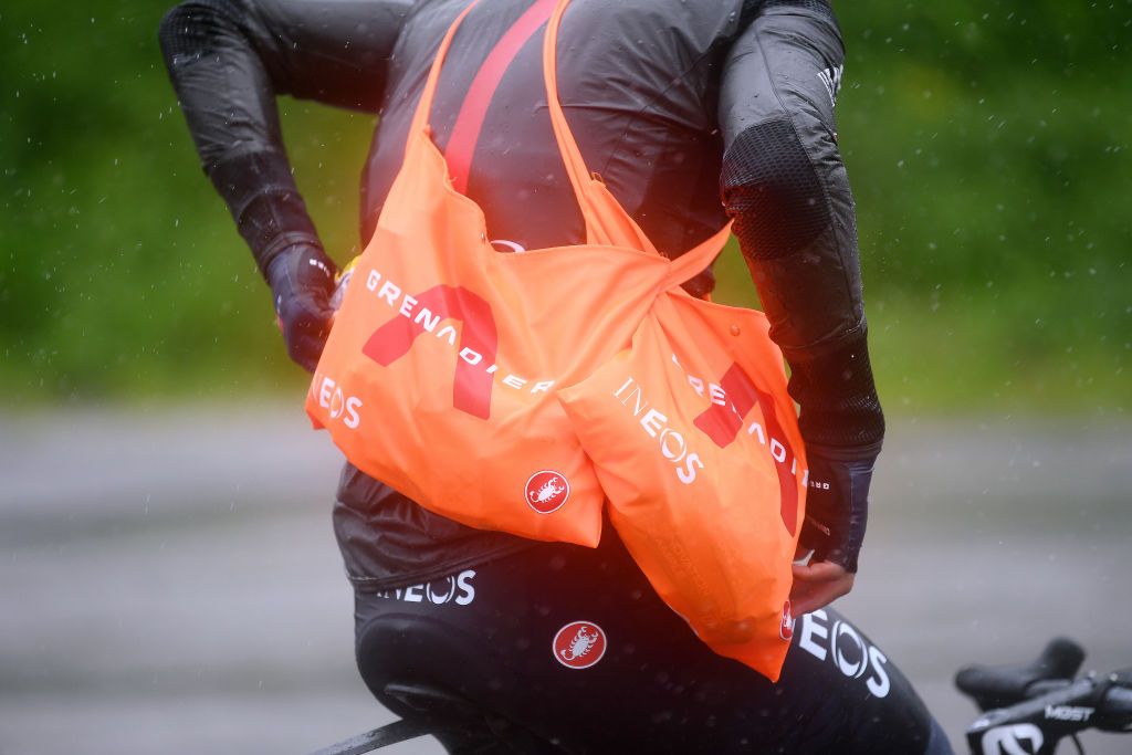 CORTINA DAMPEZZO ITALY MAY 24 Jhonnatan Narvaez Prado of Ecuador and Team INEOS Grenadiers during the 104th Giro dItalia 2021 Stage 16 a 153km stage shortened due to bad weather conditions from Sacile to Cortina dAmpezzo 1210m Rain Feed Zone Feeding Detail view girodiitalia Giro on May 24 2021 in Cortina dAmpezzo Italy Photo by Tim de WaeleGetty Images