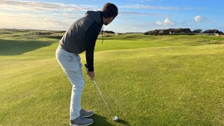 A golfer hitting a chip shot at Royal Troon
