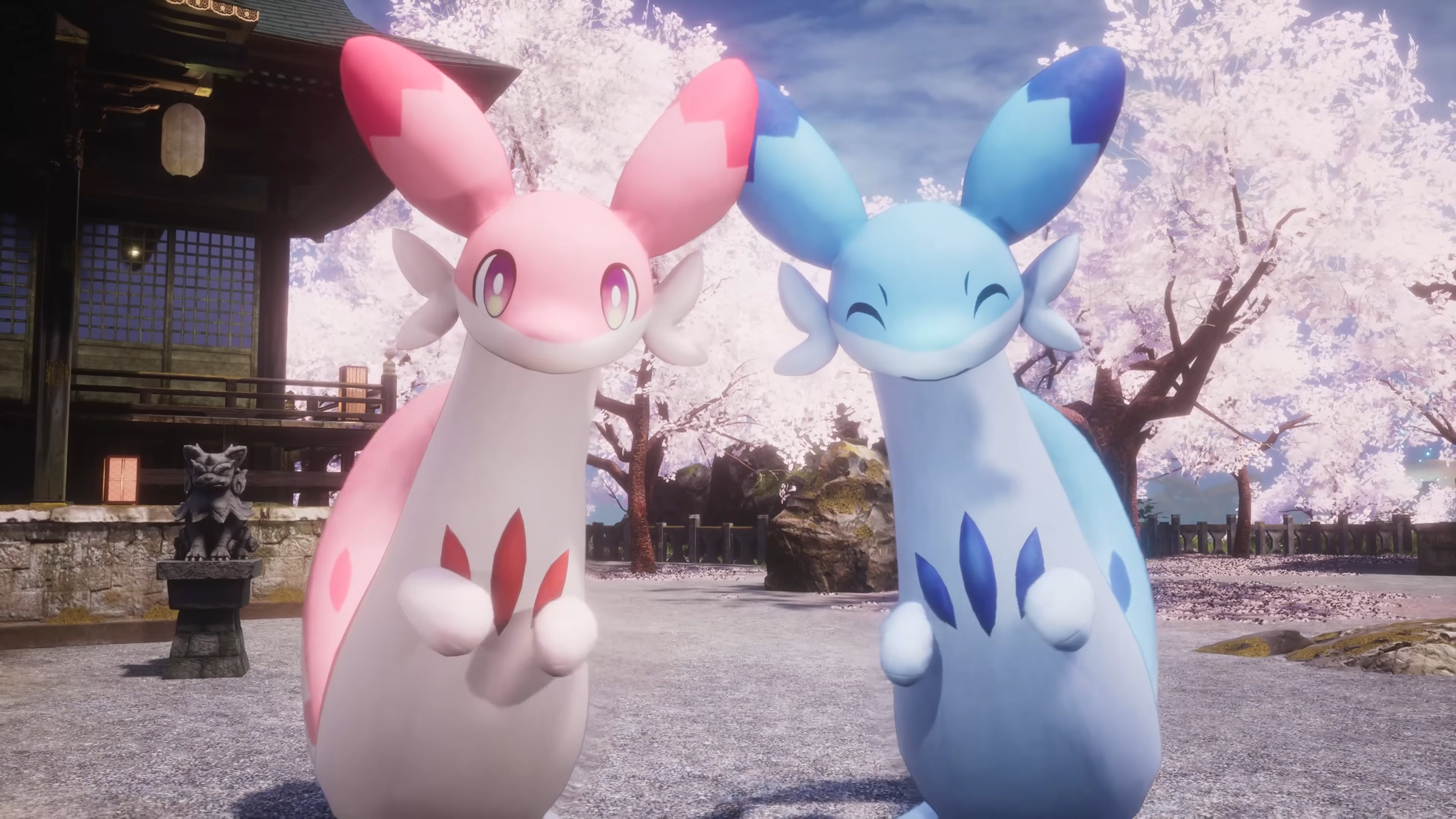 Palworld 1.0 launch trailer screenshot shows a Chillet Ignis and Chillet smiling at the camera, cherry blossom trees behind them.