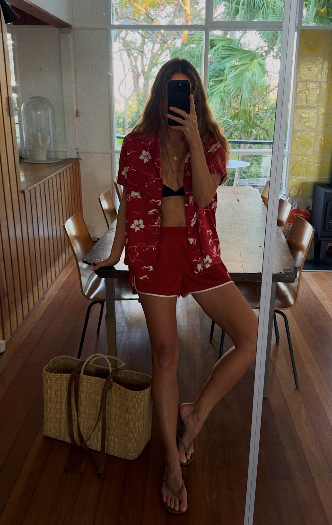 Angie wears a red shirt and red shorts