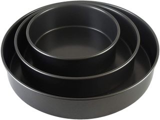 three nested metal cake pans