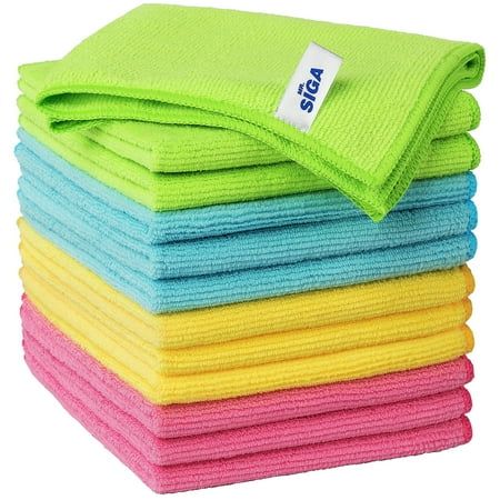A stack of folded microfiber cloths, pink on the bottom, then yellow, then blue, then green