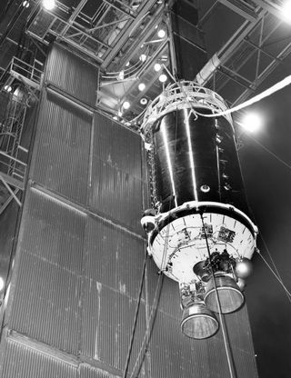 A Centaur upper stage rocket body seen in 1964 being joined to an Atlas rocket.