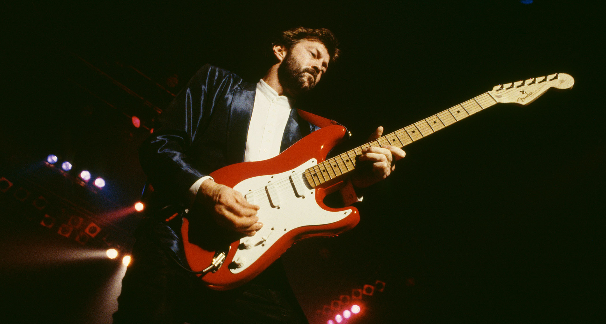 Eric Clapton plays his signature Strat in Torino Red during a mid '80s show in Italy