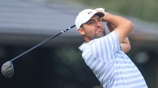 Scottie Scheffler holds his finish on a drive