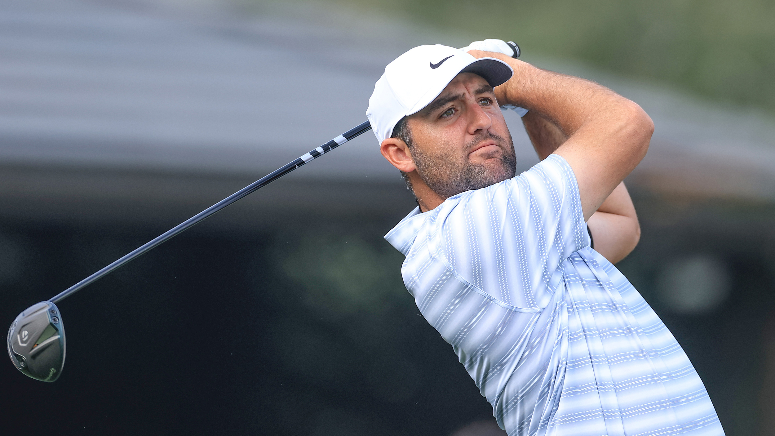 Scottie Scheffler holds his finish on a drive