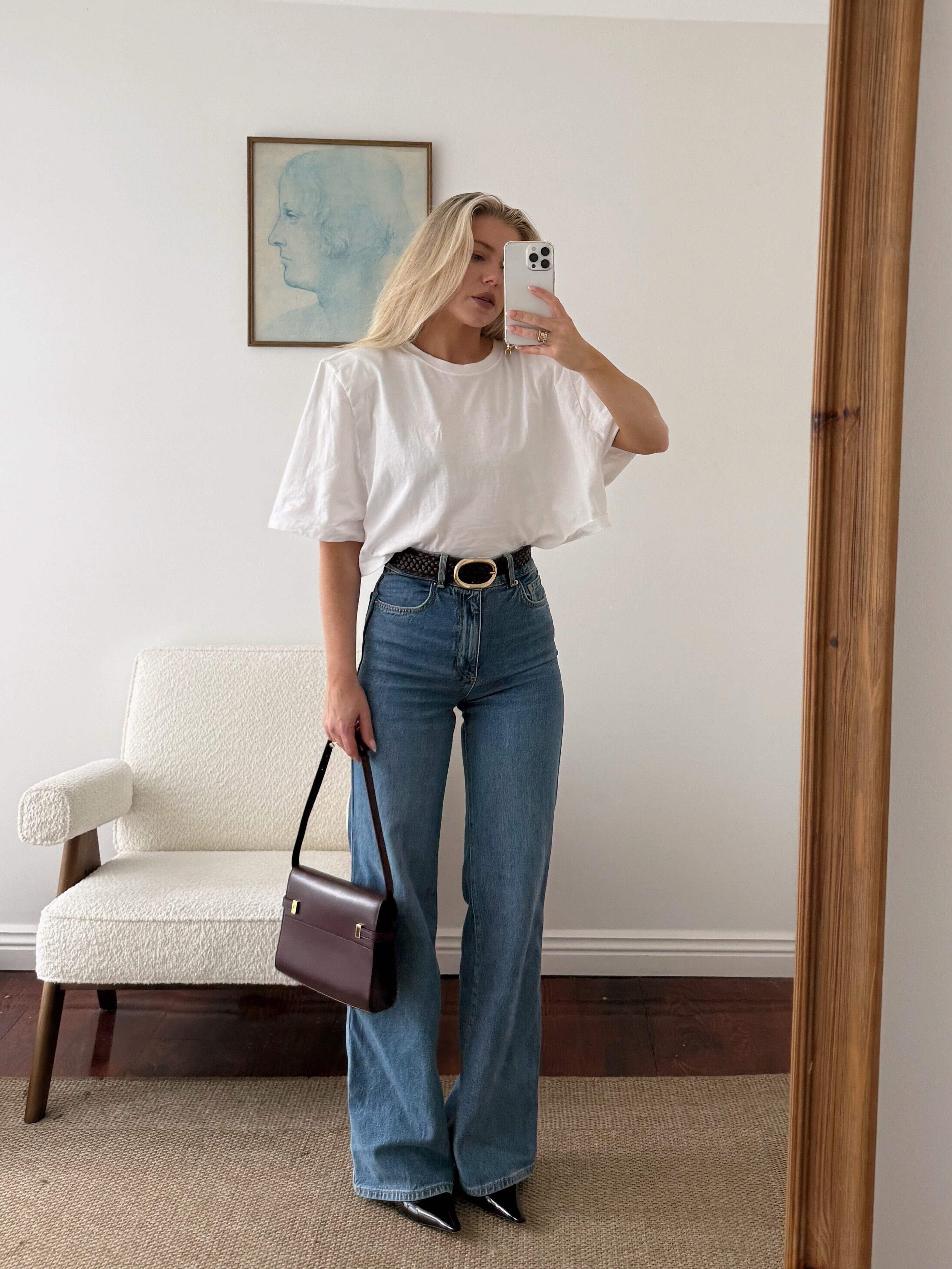A woman wearing fall boot trend with jeans in 2026.