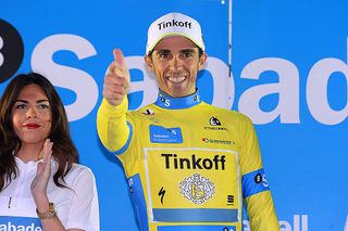 Alberto Contador (Tinkoff) give his traditional pistolero salute from the podium after winning Pais Vasco