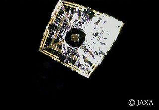 The Japan Aerospace Exploration Agency's IKAROS solar-sailing spacecraft is seen in deep space after the craft's deployment on June 14, 2010.