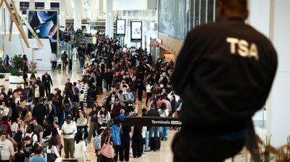 TSA agents watches long security line at New York's LaGuardia Airport
