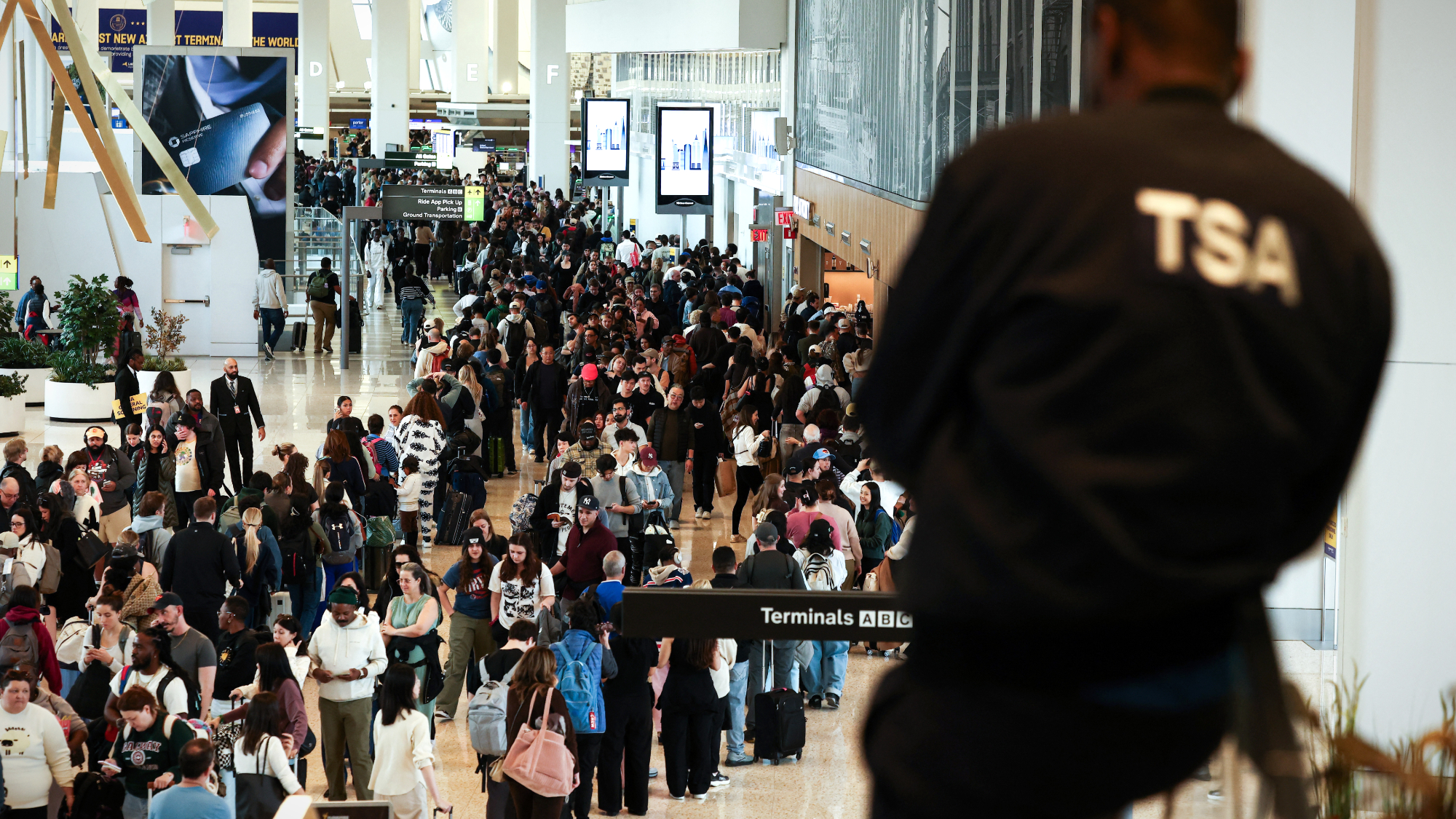 TSA agents watches long security line at New York's LaGuardia Airport